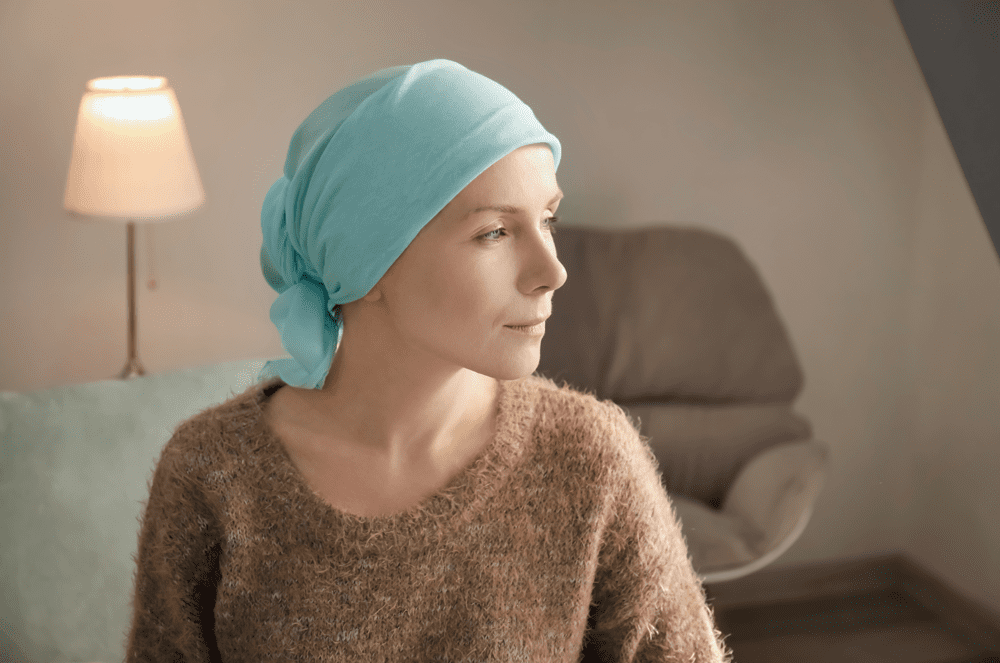 woman considering hair loss solutions for cancer treatment.