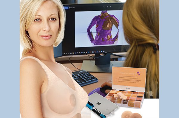 A woman sitting in front of a computer screen.